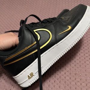 Nike Air Force 1 black sneakers men’s size 8. Gold swoosh